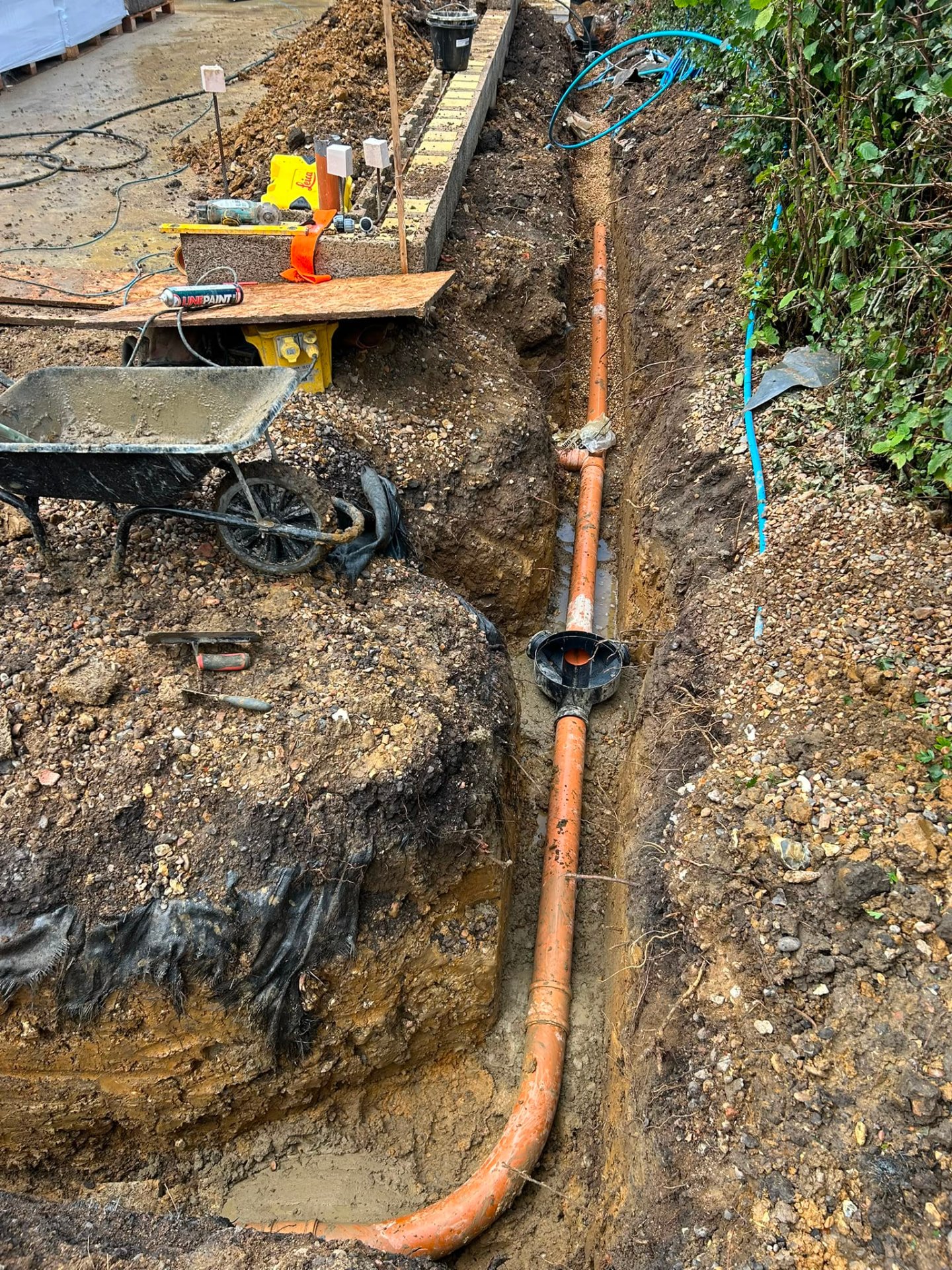 Drainage run and inspection chamber installed in a trench at Buntingford