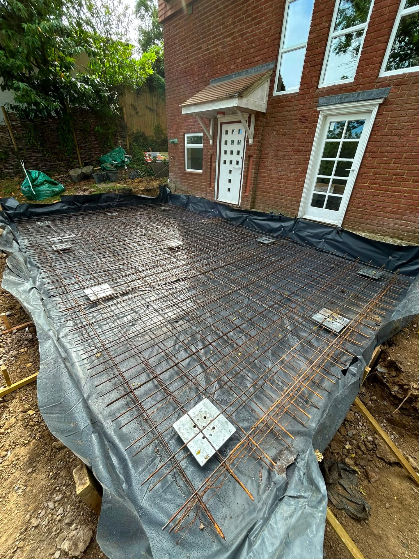 Reinforcement mat laid over screw piles at Windsor